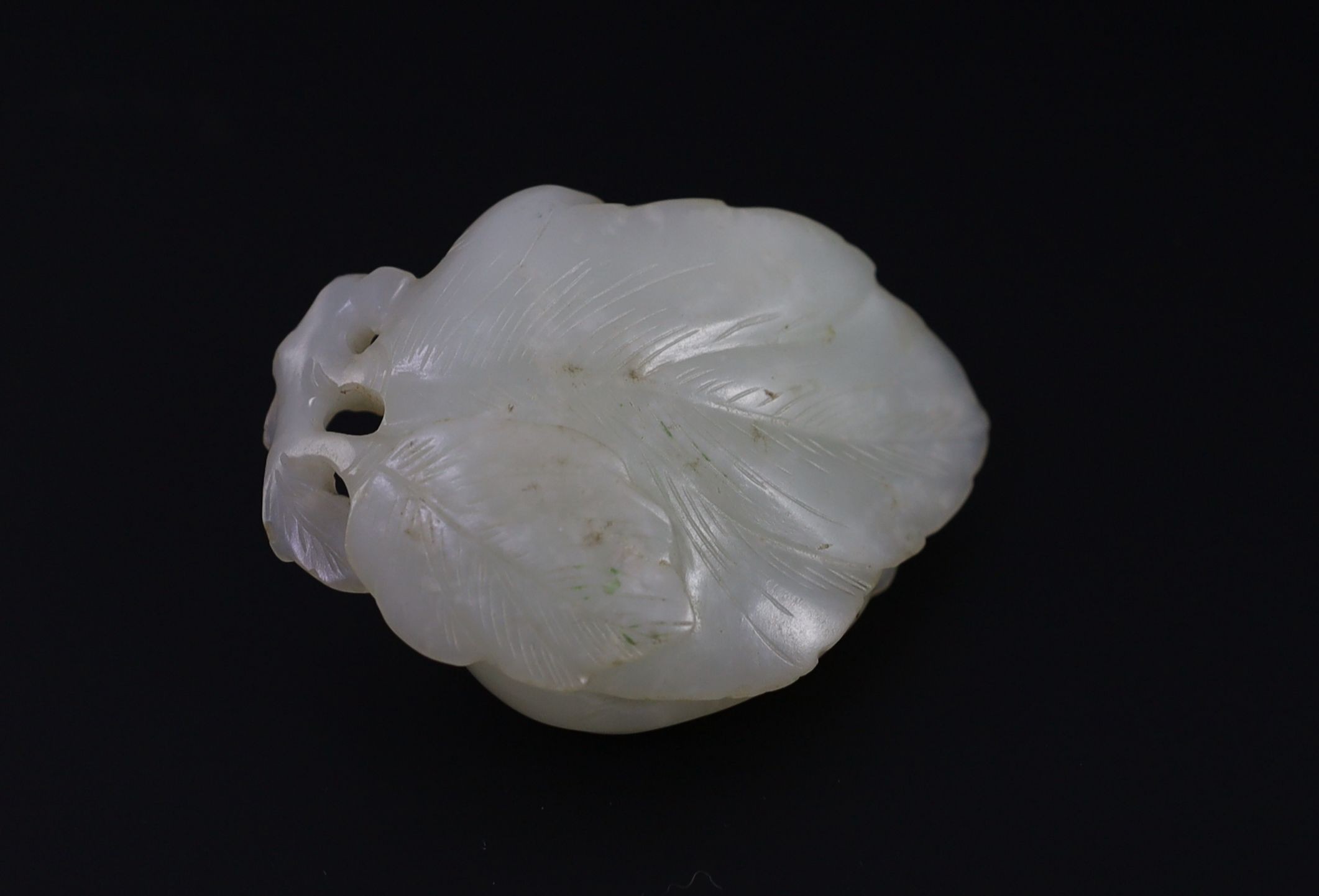 A Chinese pale celadon jade ‘cats and butterfly’ group, 18th/19th century, 6cm long